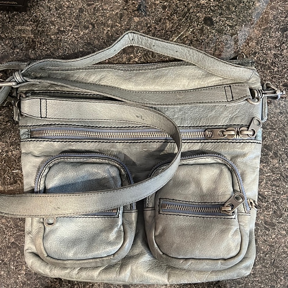 Liebeskind Purse. Inside/outside pockets. Adjustable shoulder strap. 12” x 11”.
